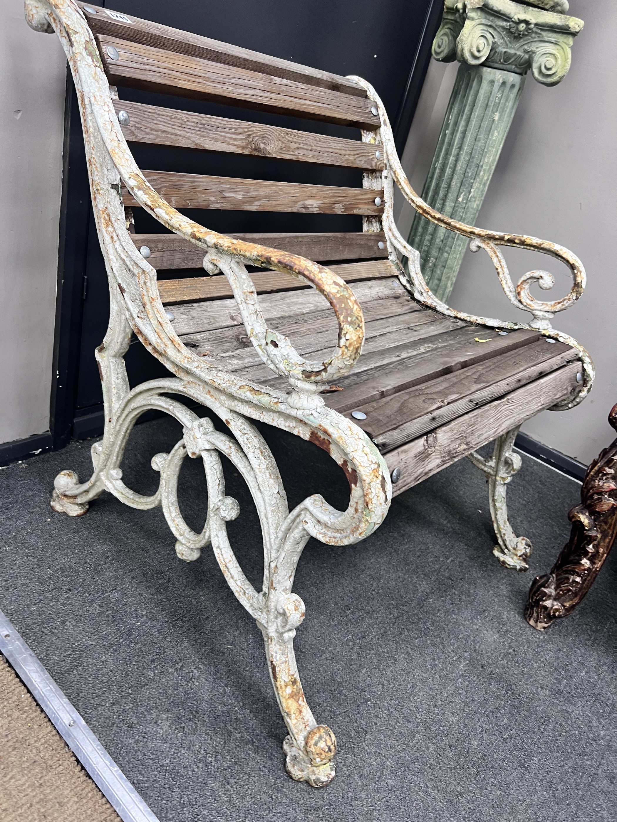A Victorian painted cast iron slatted garden seat, reduced, width 67cm, depth 64cm, height 76cm